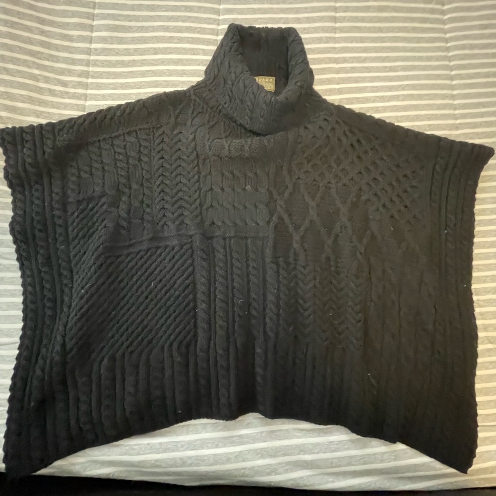 100% Merino wool poncho sweater.